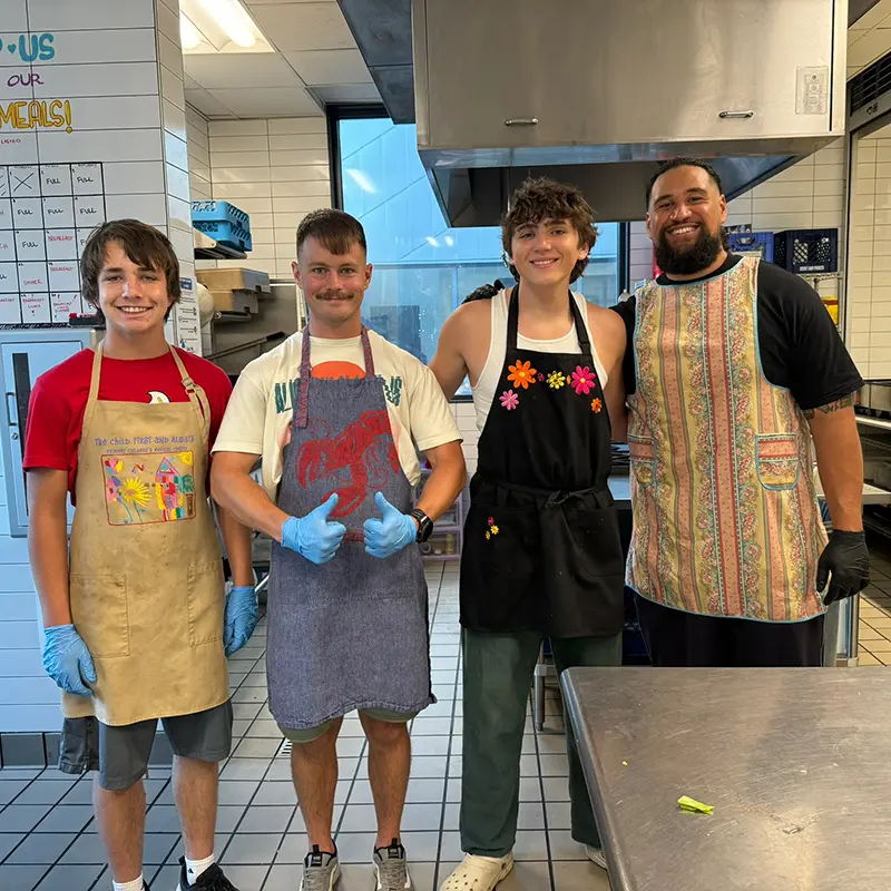 A group of young volunteer in a community kitchen